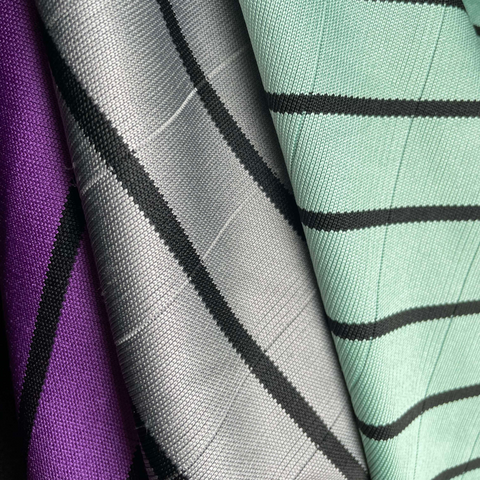 3 different colour glass microfiber cloths hanging, purple, green and grey
